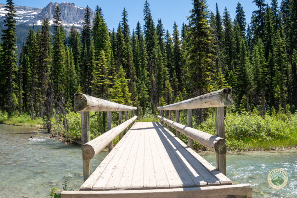Wooden bridge over a glacier-fed stream on the Emerald Lakeshore Loop Yoho