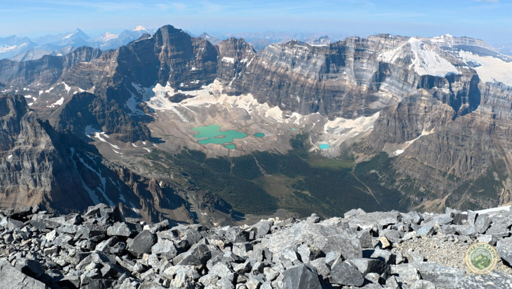 View from the Mount Temple summit toward the glacier lakes of Paradise Valley