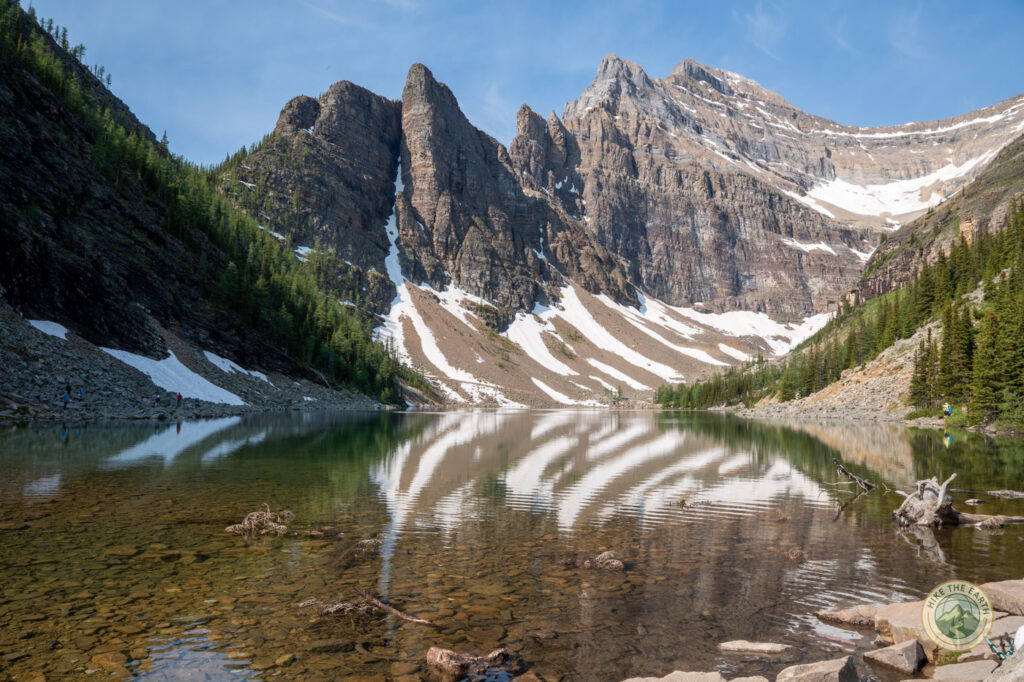 Lake Agnes Tea House trail view with mountain reflection on the way to the Big Beehive hike